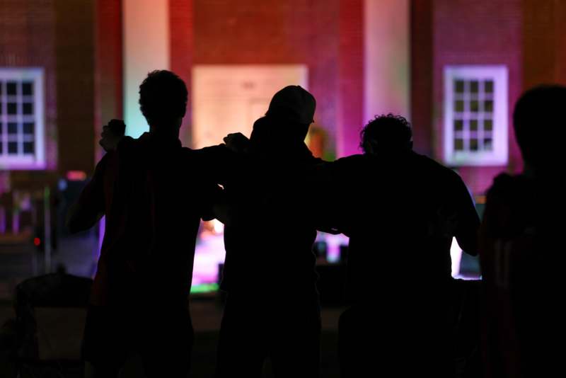 a group of people standing in front of a building