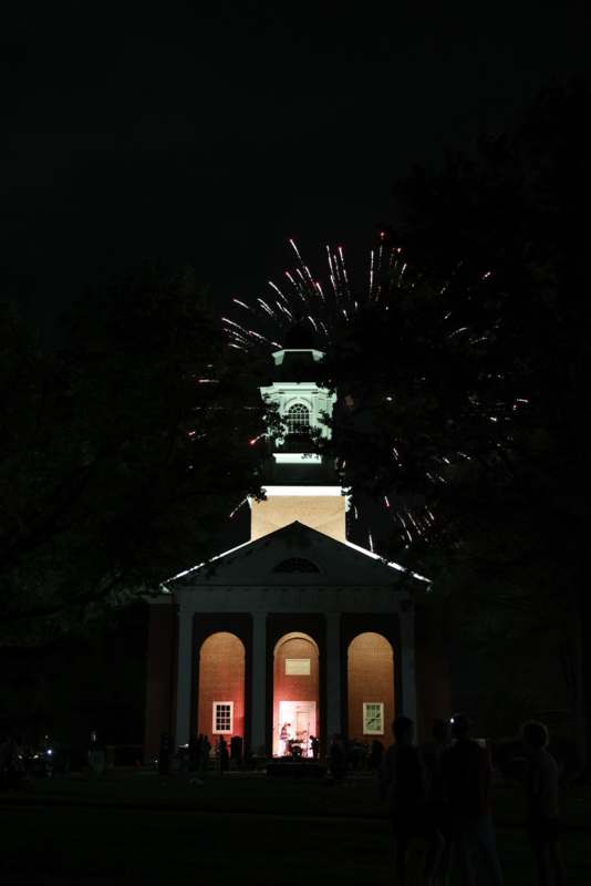 fireworks in the sky above a building