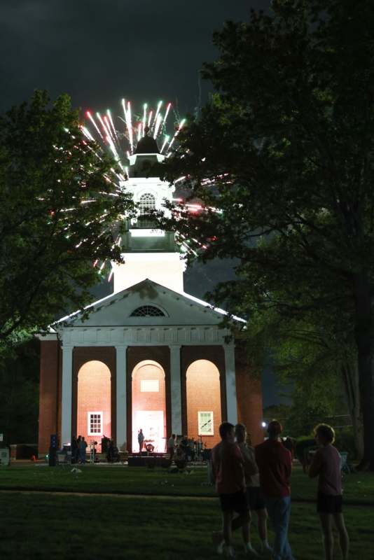 fireworks exploding over a building