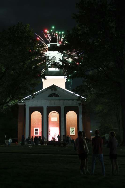 a building with fireworks in the sky