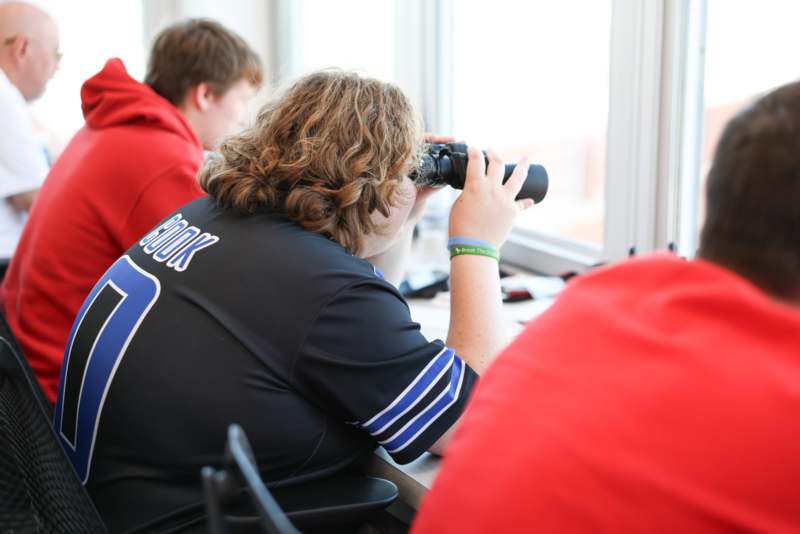 a person looking through binoculars
