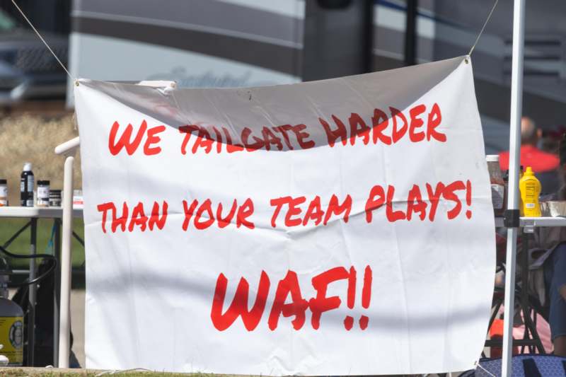 a white sign with red writing