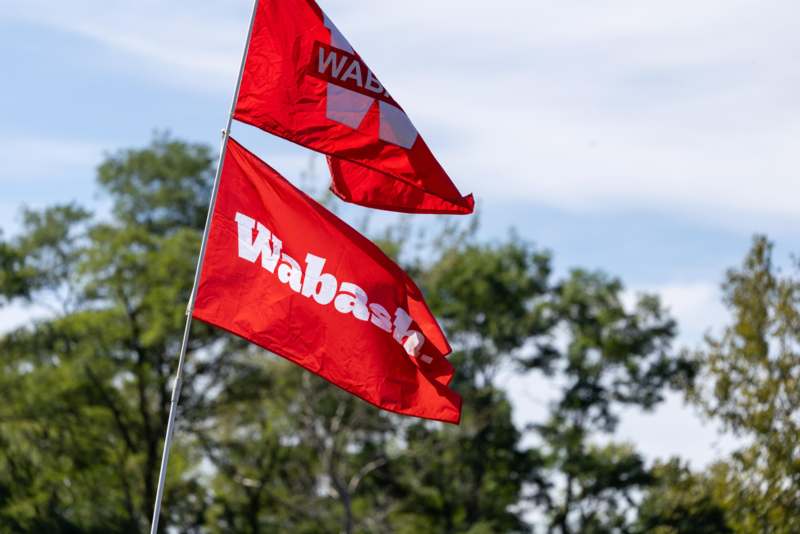 two red flags on a pole
