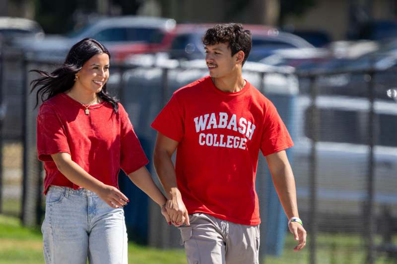 a man and woman holding hands
