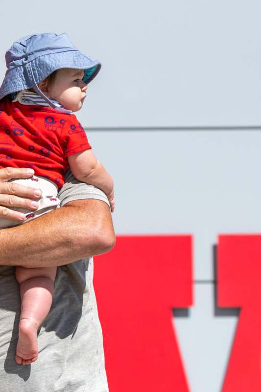 a man holding a baby