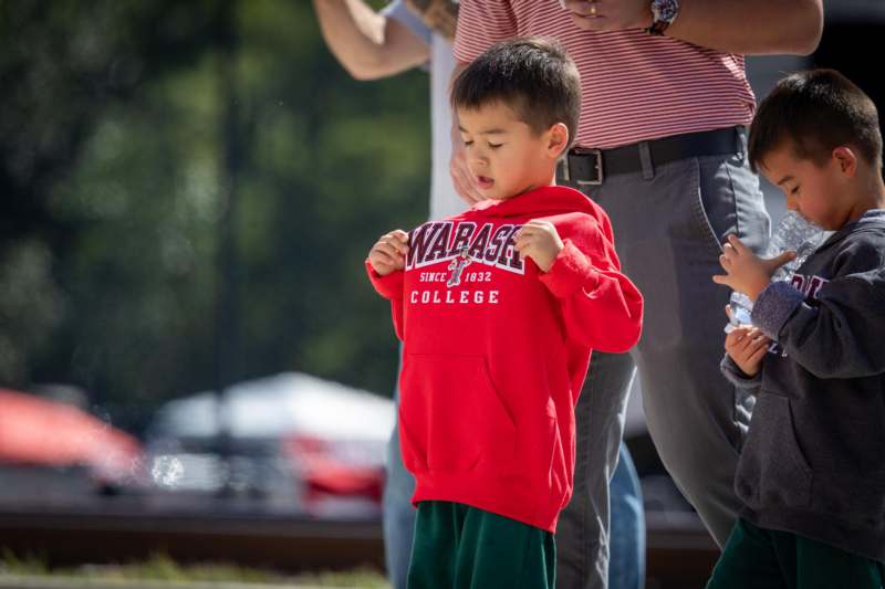 a child holding a sign