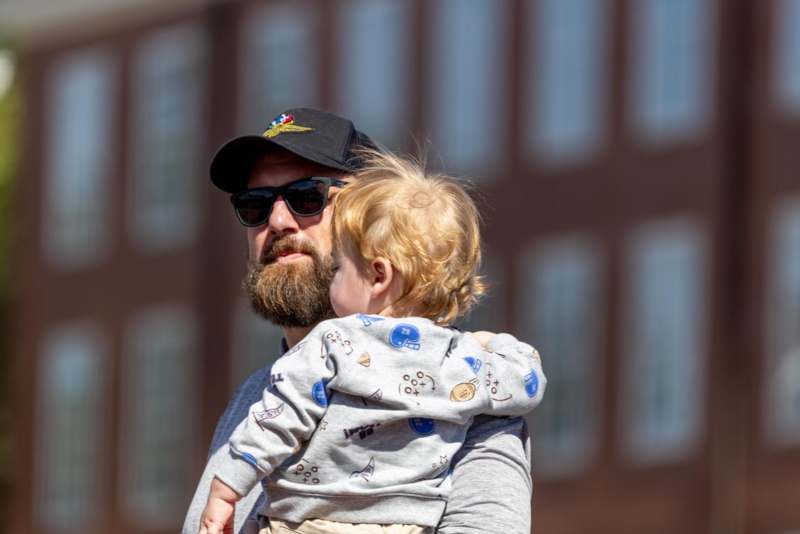 a man holding a baby