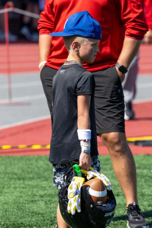 a boy holding a football