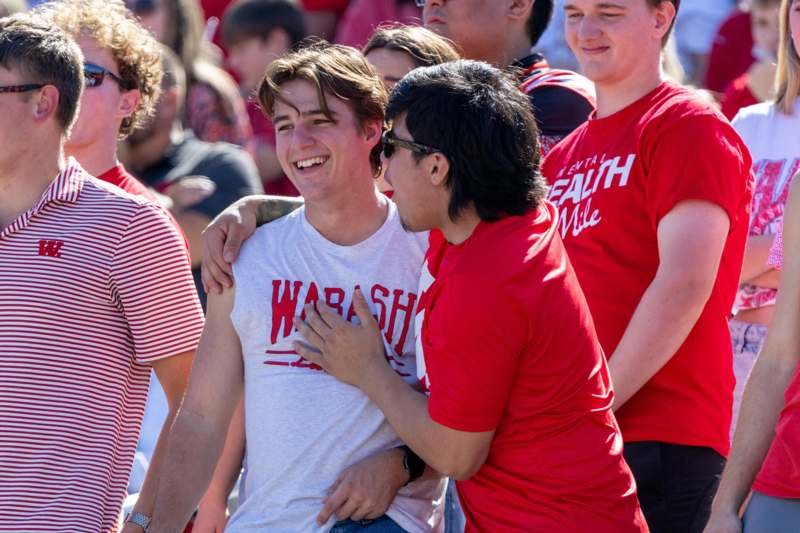 a group of people in red shirts