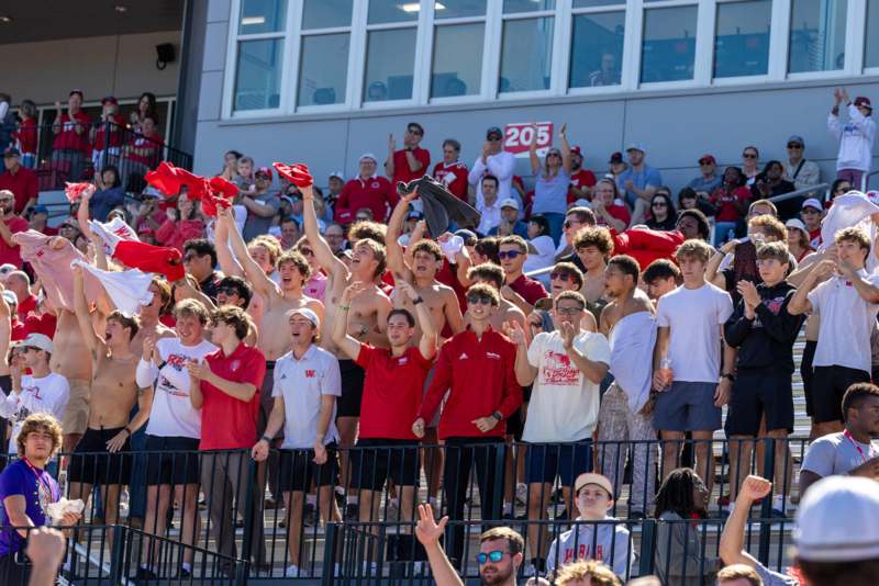 a group of people in red shirts