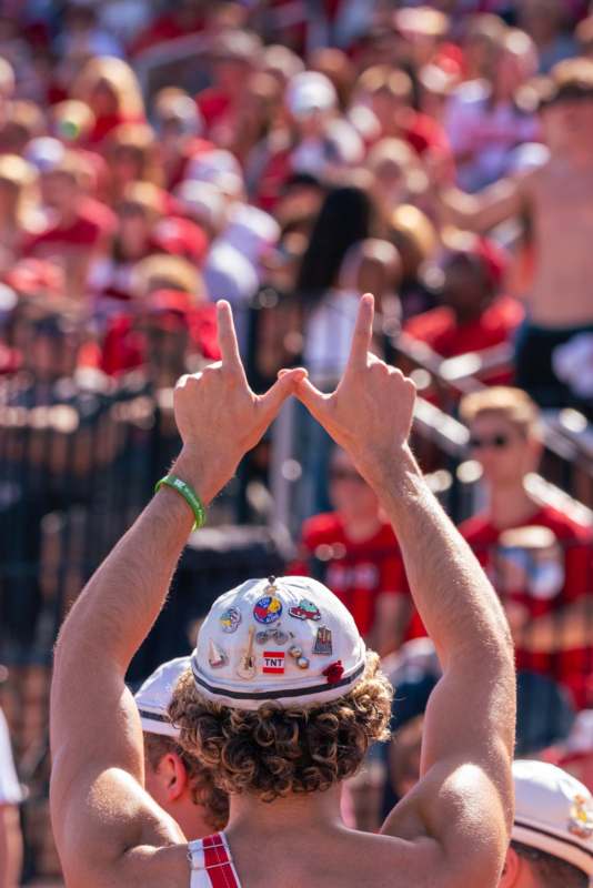 a person with their hands up in the air