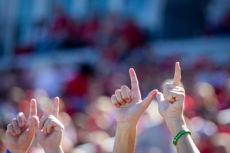 a group of hands pointing up