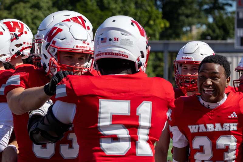 a group of football players in a huddle
