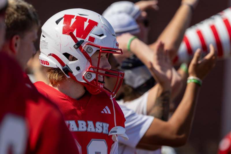 a football player in a red uniform with a red helmet