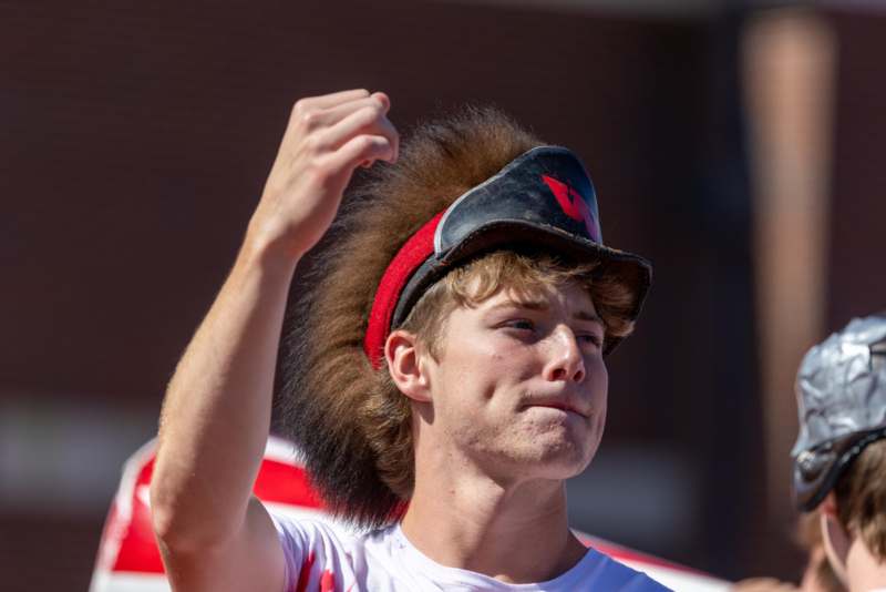 a man with a mohawk hat
