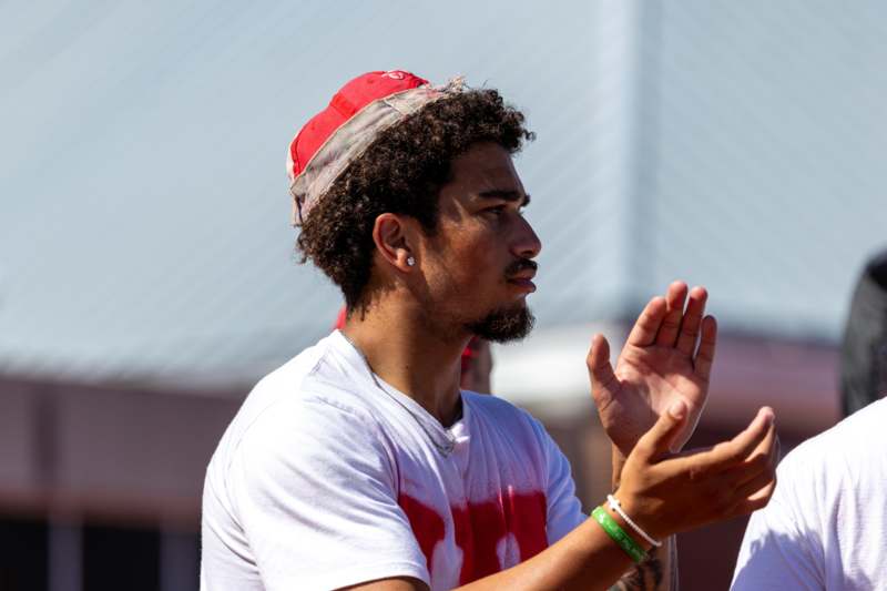 a man with a beard and a red hat
