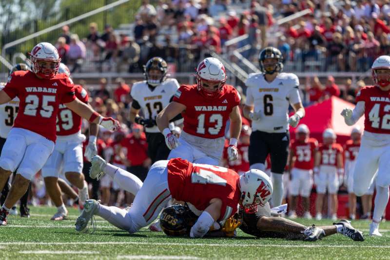 a football player falling down on the ground