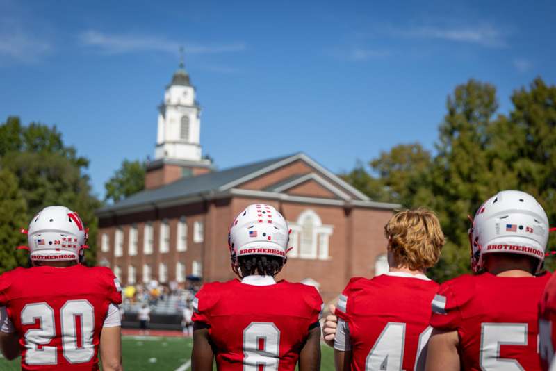 a group of football players in red uniforms
