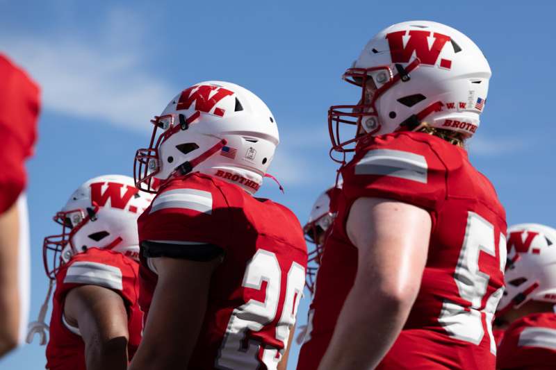 a group of football players wearing helmets
