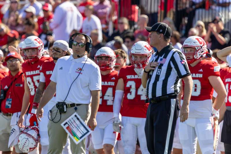 a football coach and a group of people