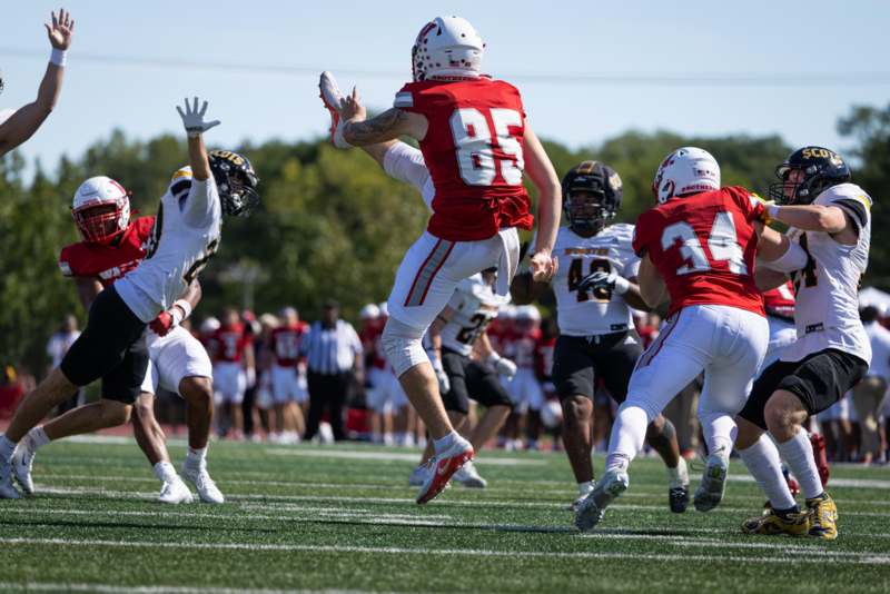 a group of people playing football