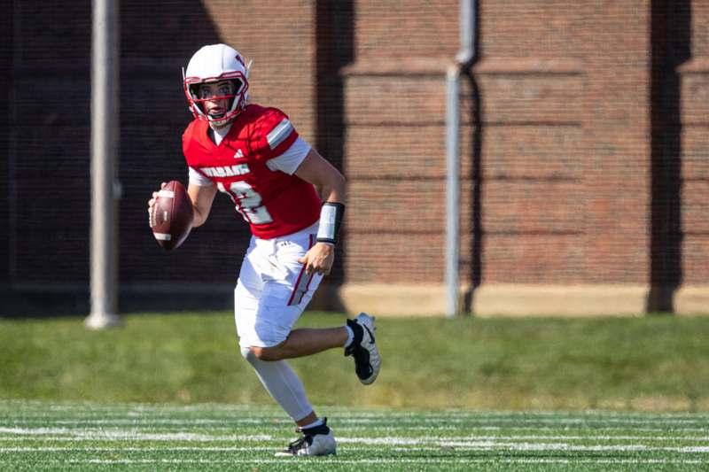 a football player running with a football
