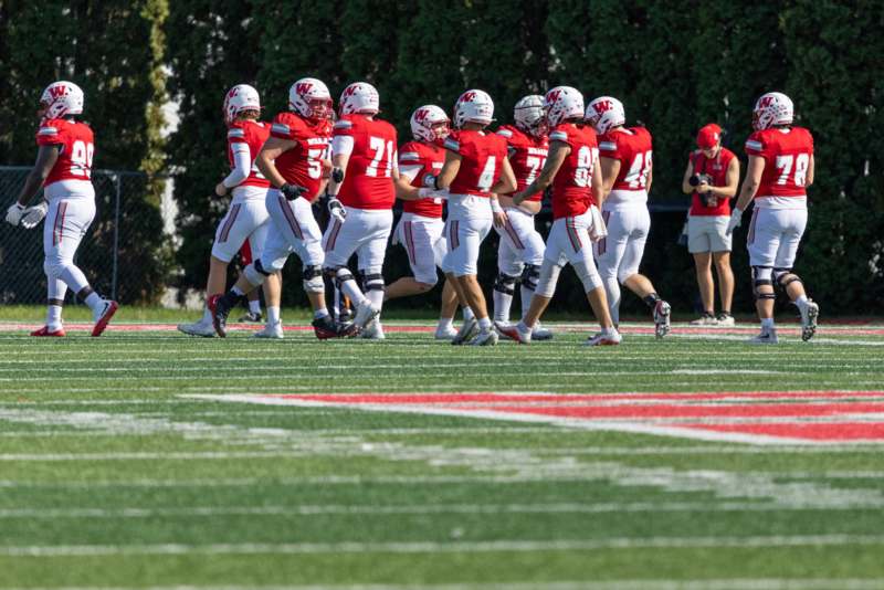 a group of football players on a football field