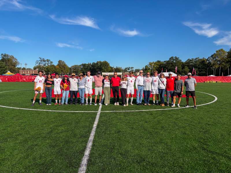a group of people standing on a field