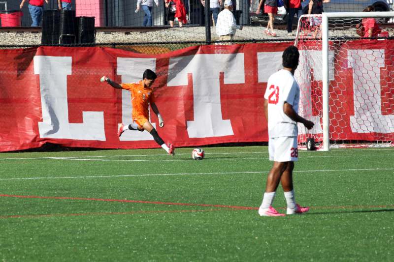 a football player kicking a ball