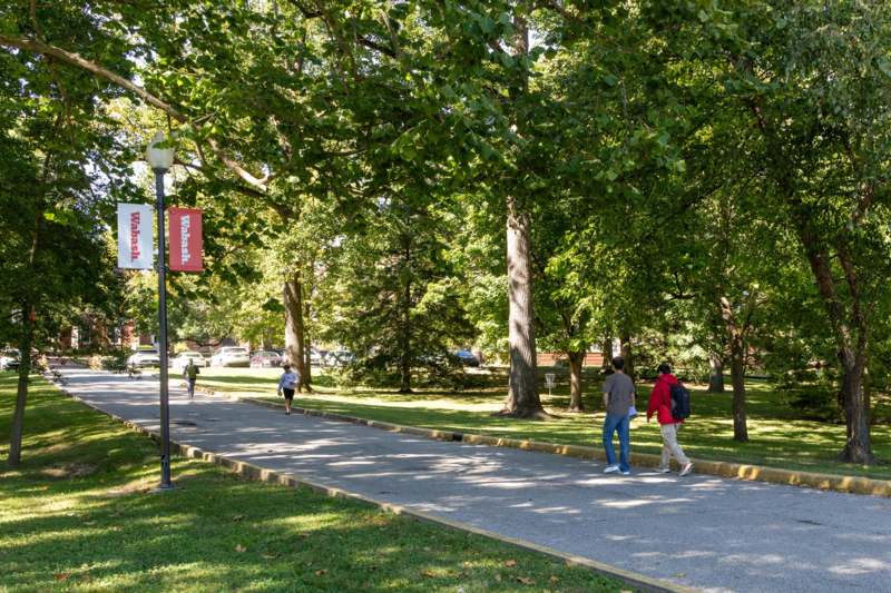 people walking on a sidewalk