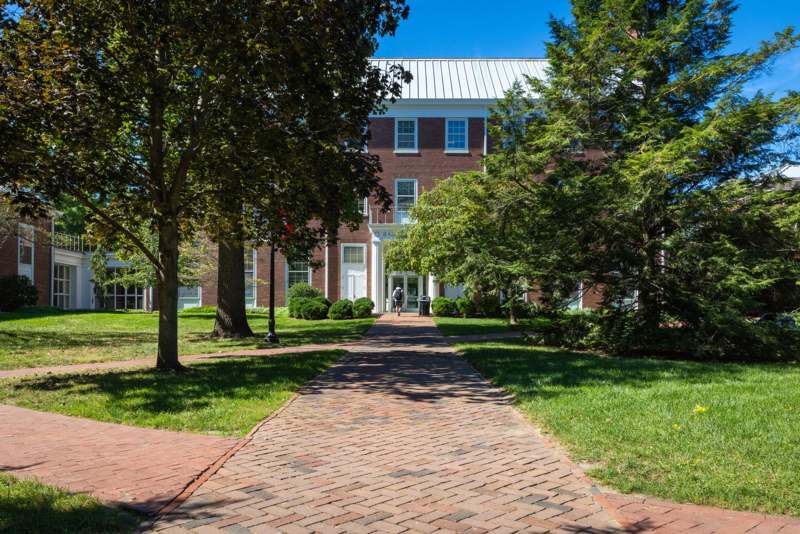a brick walkway leading to a building