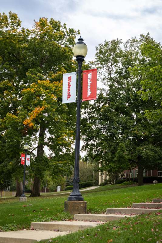 a lamp post with a sign on it