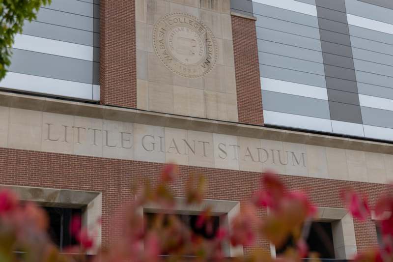 a brick building with a logo on the side