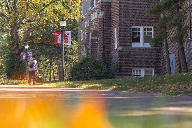 a person walking down a sidewalk