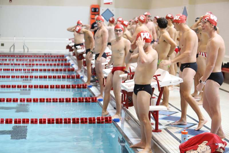 a group of men in swim suits