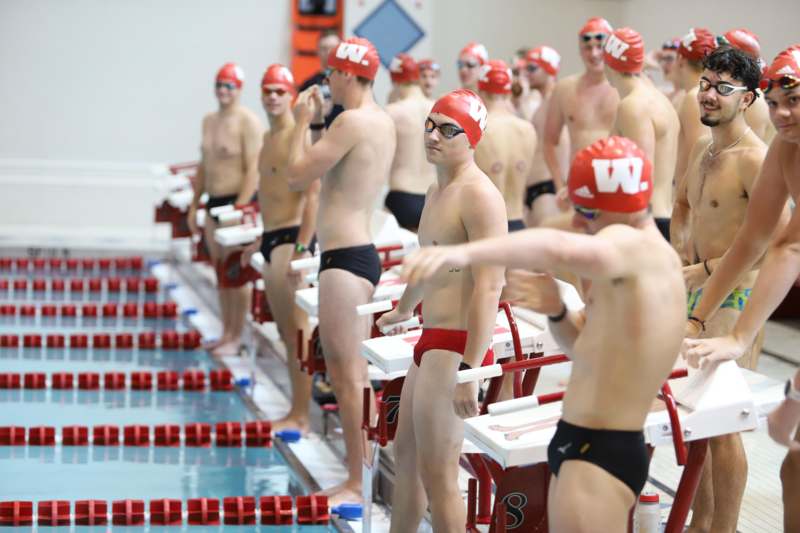 a group of men in swim suits