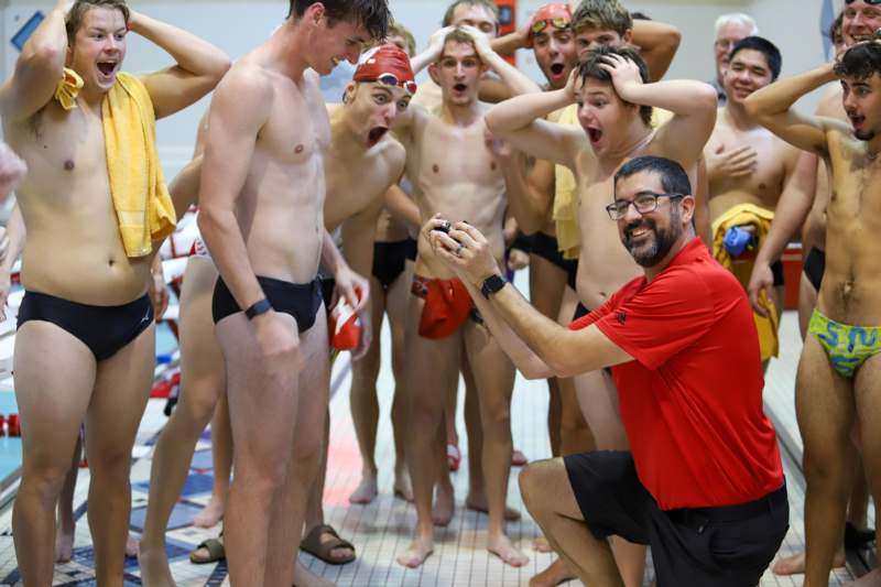 a group of men in swim suits