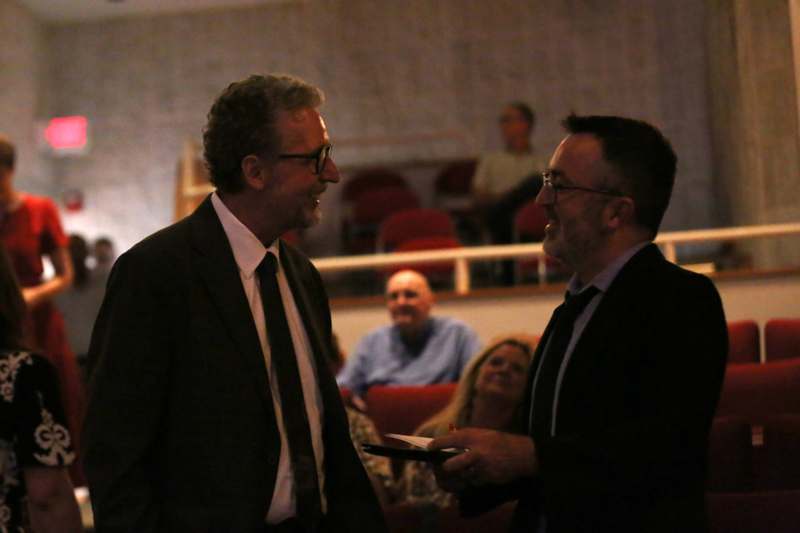 two men in suits talking