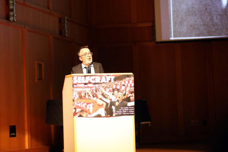 a man standing at a podium
