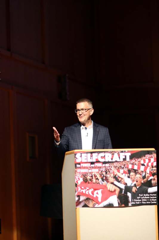 a man standing at a podium