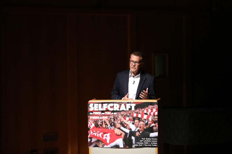 a man standing at a podium