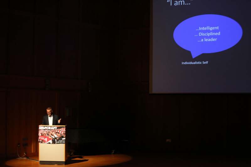 a man standing at a podium