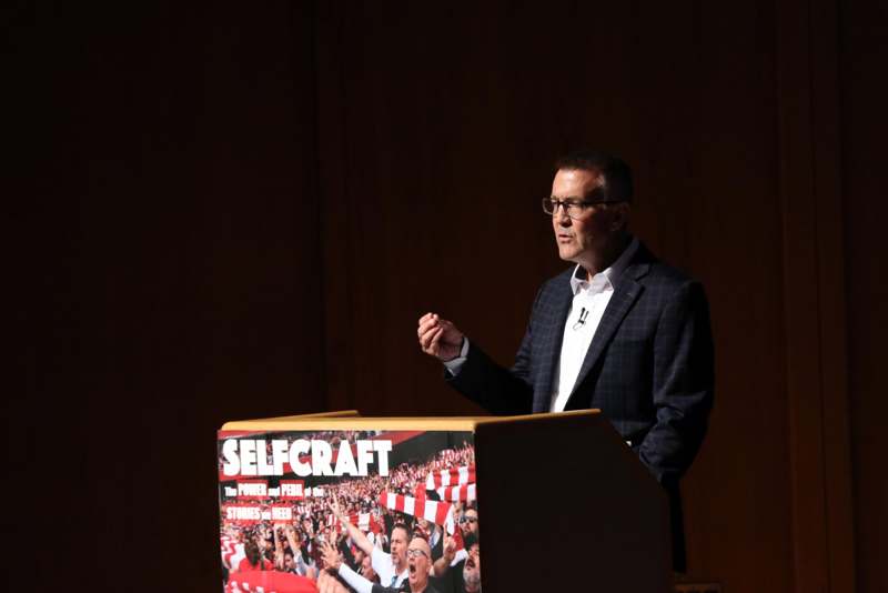 a man standing at a podium