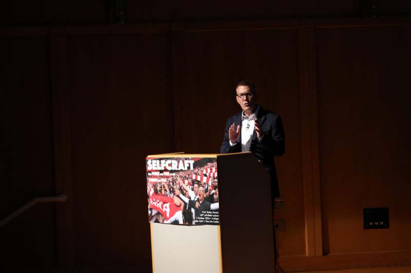 a man standing at a podium