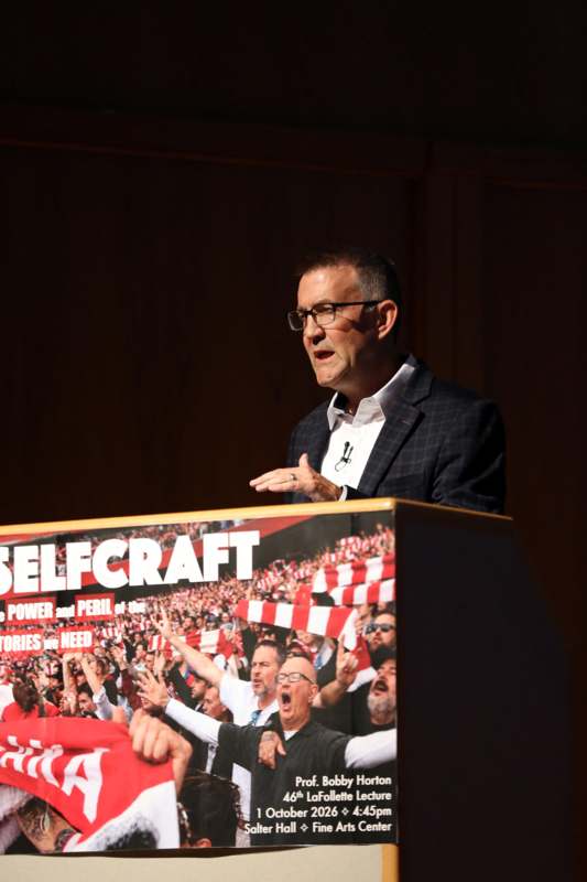 a man standing at a podium