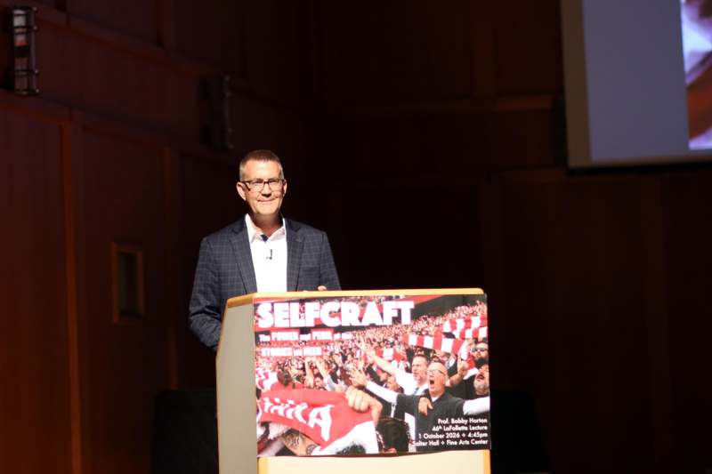a man standing at a podium
