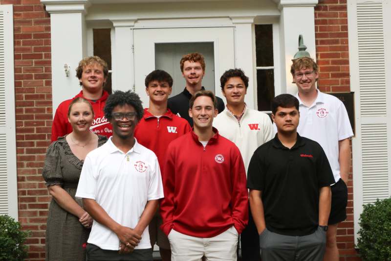 a group of people standing in front of a building