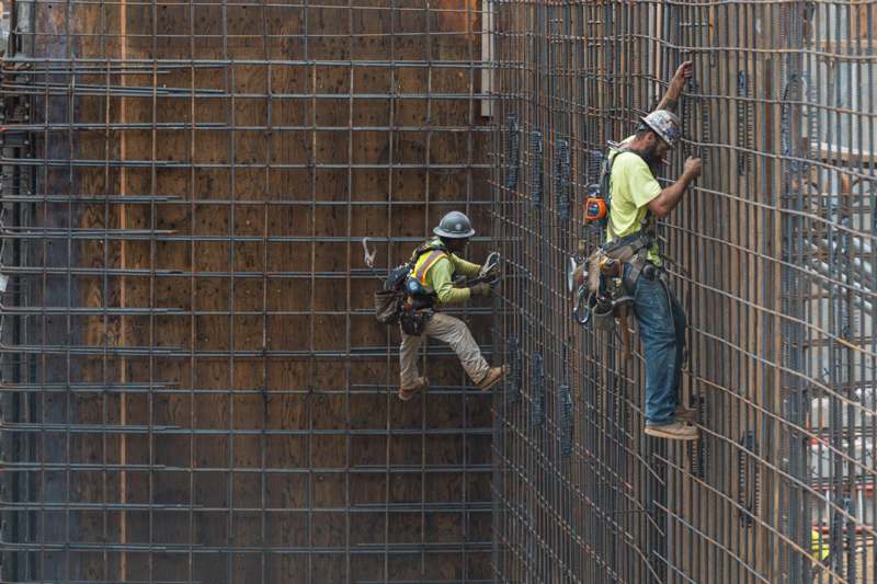 a group of men working on a building