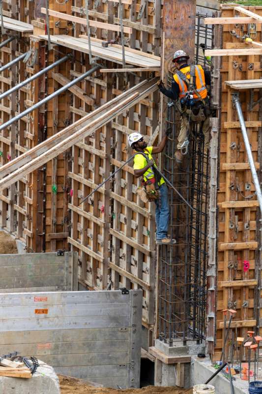 a group of men working on a building