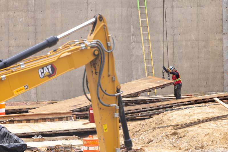 a construction worker holding a piece of wood